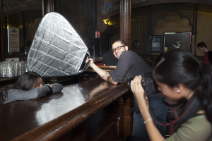 Assisting a young photographer at a high school photo workshop