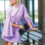 High-key fashion portrait featuring contemporary seasonal apparel photographed for a magazine editorial.