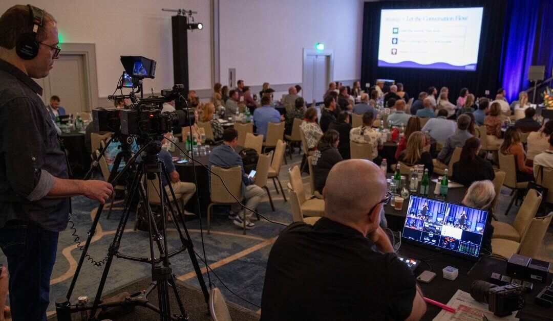 James Patrick Photography and LUMEDIA Creative production team filming keynote presentations during Troon's 2026 Fusion Forum conference in Tucson, Arizona using professional Sony cinema cameras for corporate event video production.